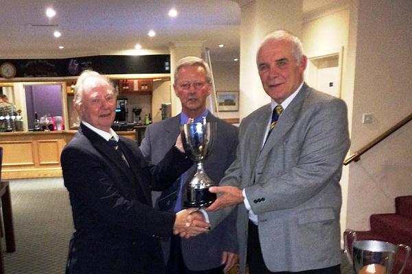 Captain Tony Hodgson presents Geordie Mawson with the May Fu Two Trophy, with Chairman Alan Brewer.jpg